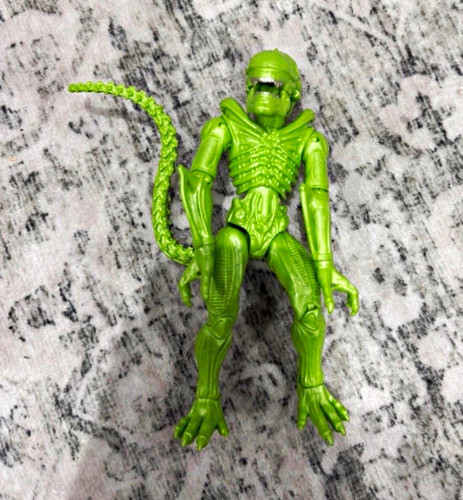Green plastic alien character - plastic,